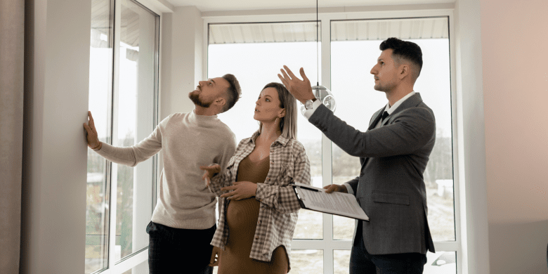 couple shown house by estate agent